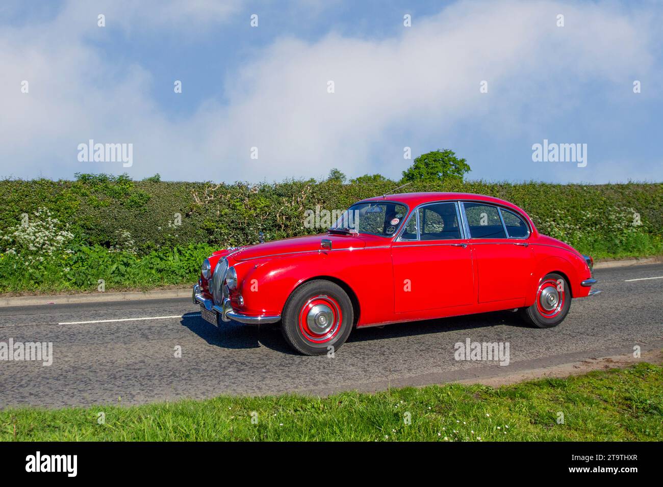 1968 60s sixties Red British Jaguar Mark 2 240 , luxury executive car, Petrol 2483 cc, 2.5 l, Cylinders 6 Cyl;  sports and performance car enthusiasts travelling in Cheshire, UK Stock Photo