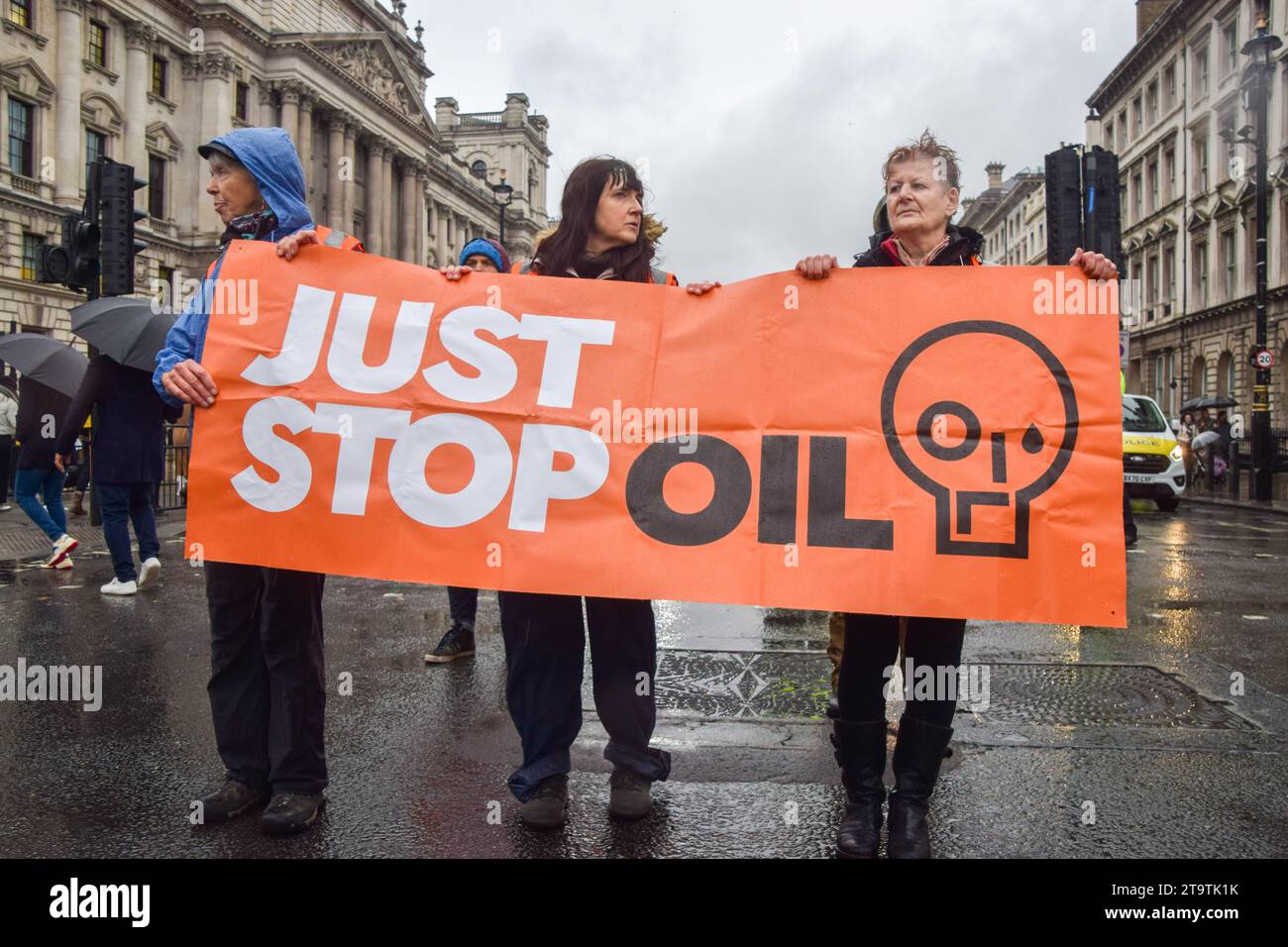 London, UK. 27th November 2023. Just Stop Oil activists march in