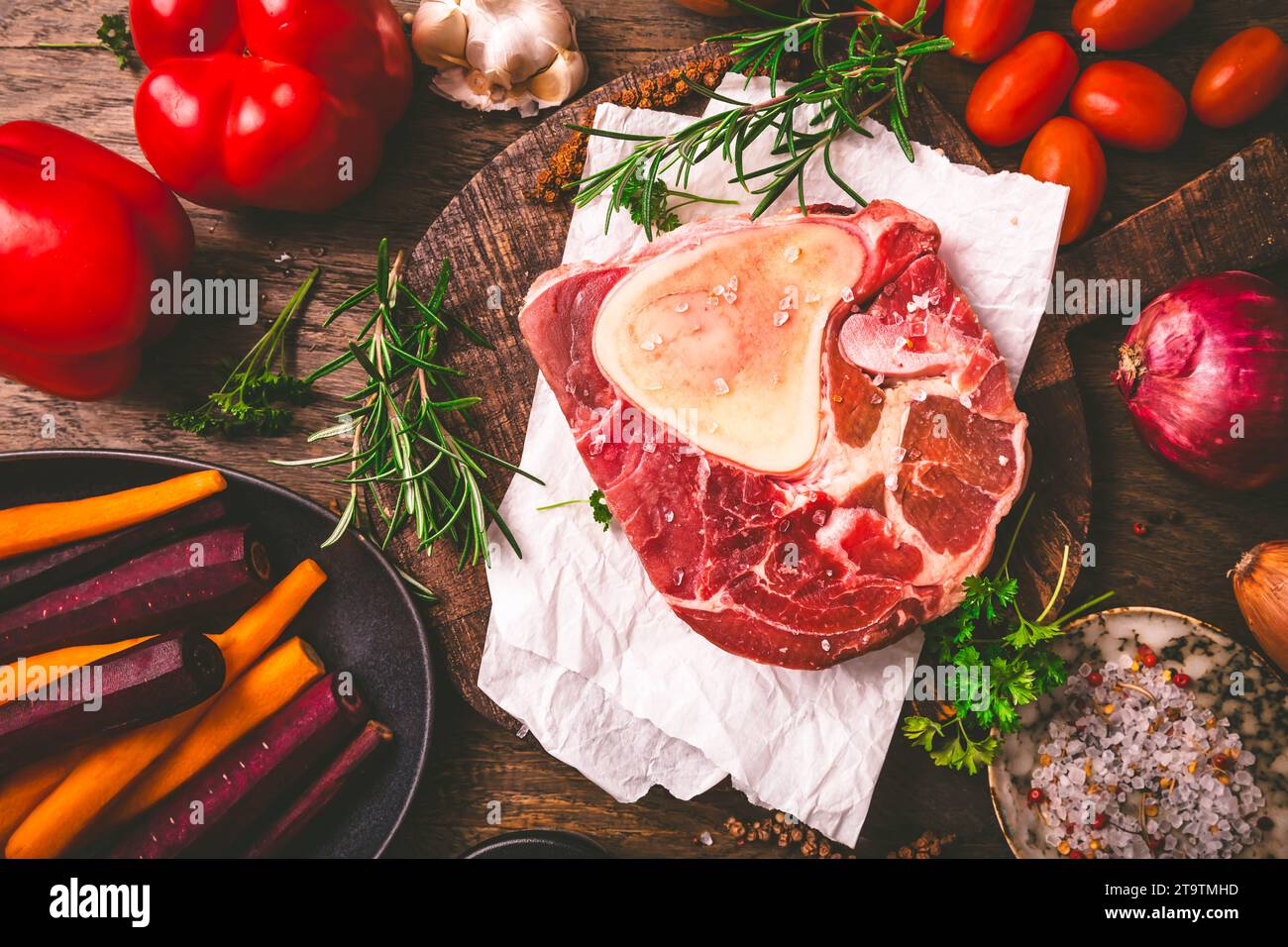 Raw beef meat shank steak, with  ingredients for preparation of ossobuco Stock Photo