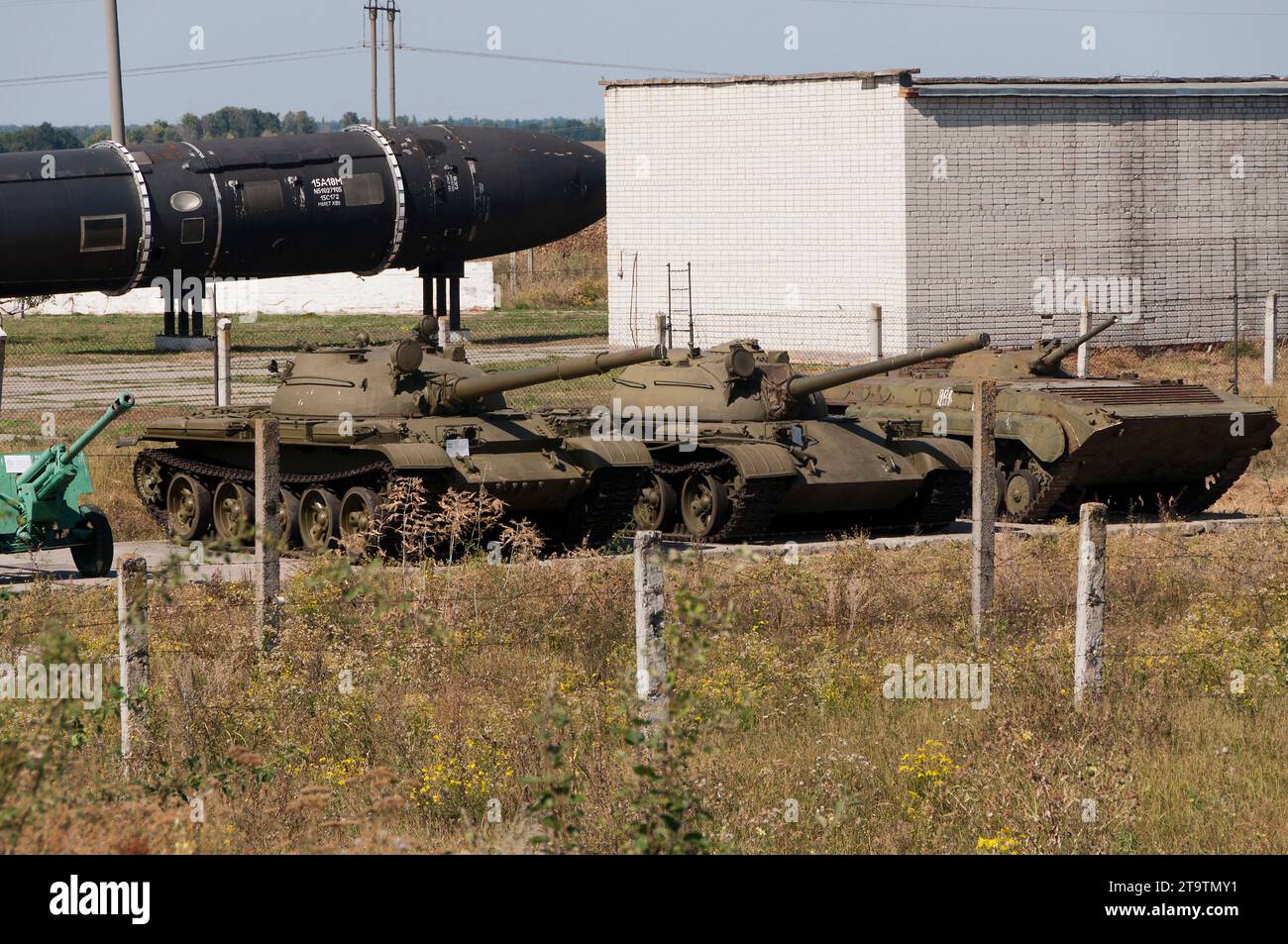 Soviet era tanks with a R-36 (NATO: SS-18 “Satan”) ICBM in the background Stock Photo