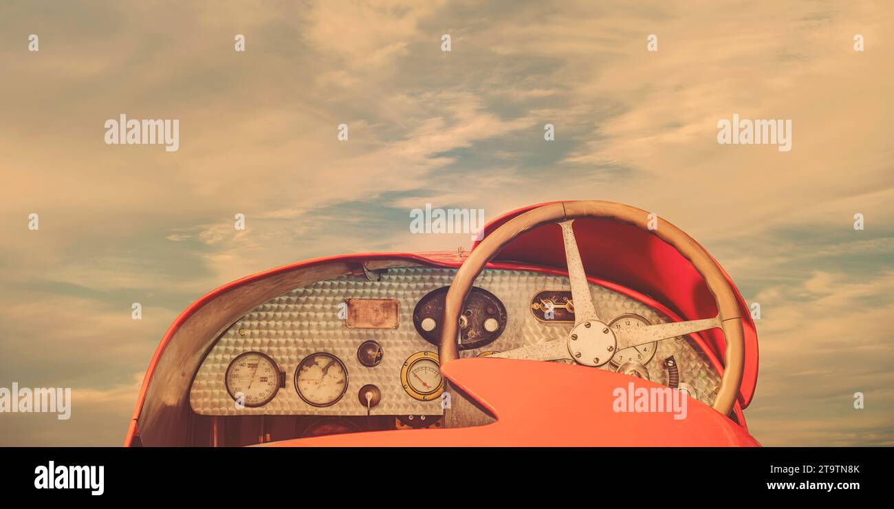 Rear view of a classic French sports car of the early twentieth century in front of a blue cloudy sky Stock Photo