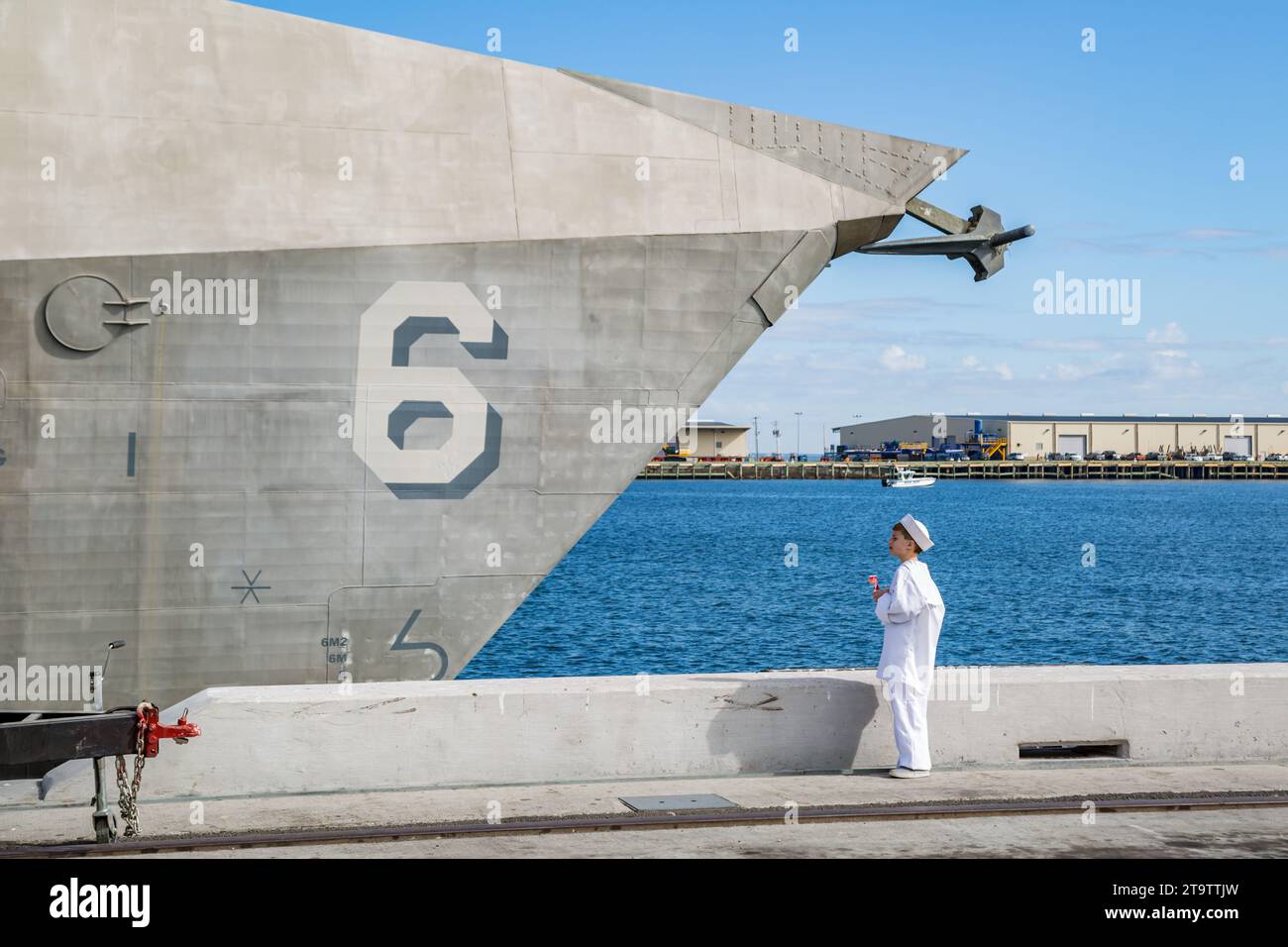 A boy dressed in sailor uniform dreams of the day he will join the US Navy during the
