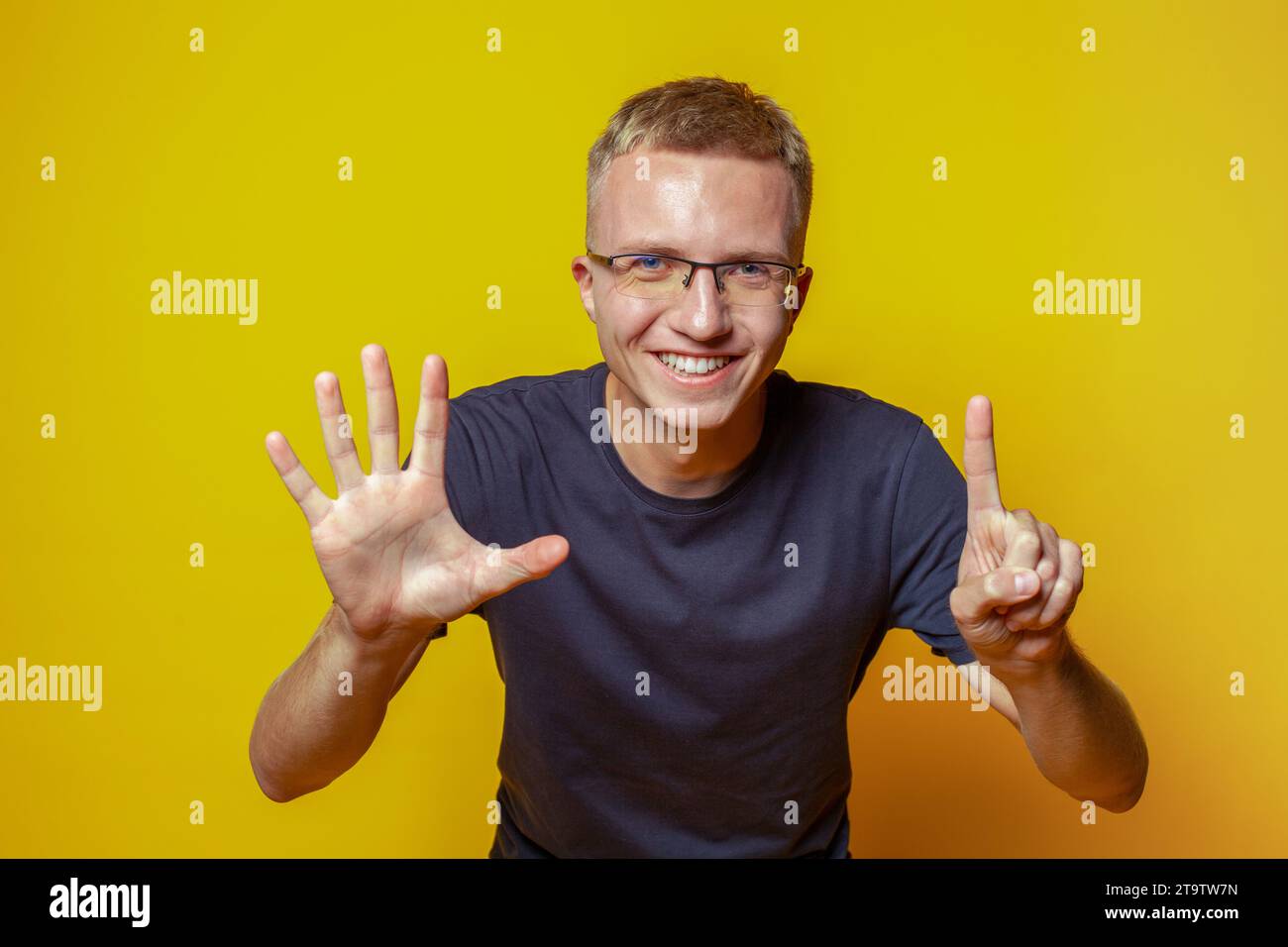 Number 6 Clapping Portrait of casual man showing fingers number six while smiling ...
