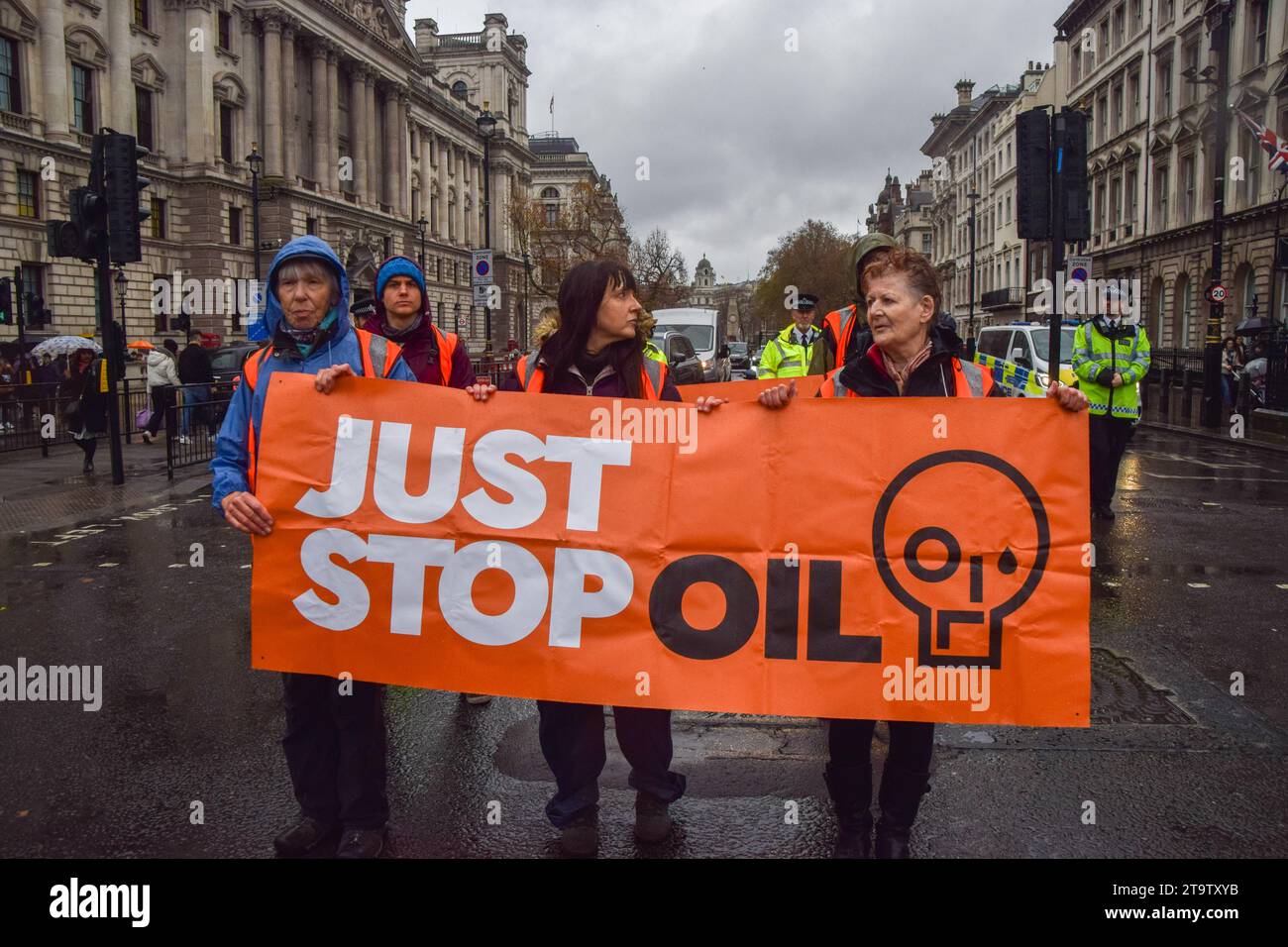 London, UK. 27th November 2023. Just Stop Oil activists march in