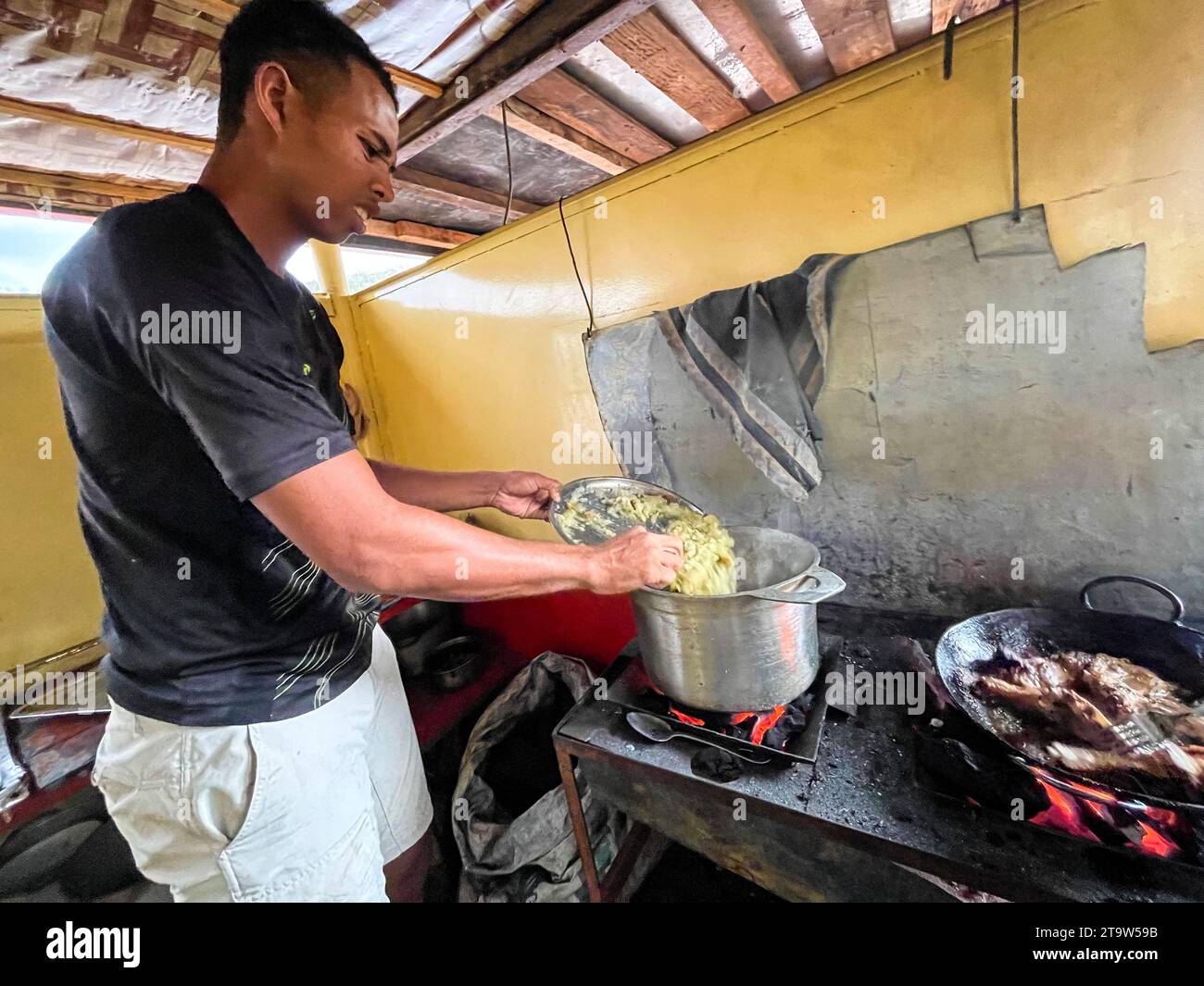 Madagascar, Tsiribihina river, cook in the kitchen of the boat Stock Photo