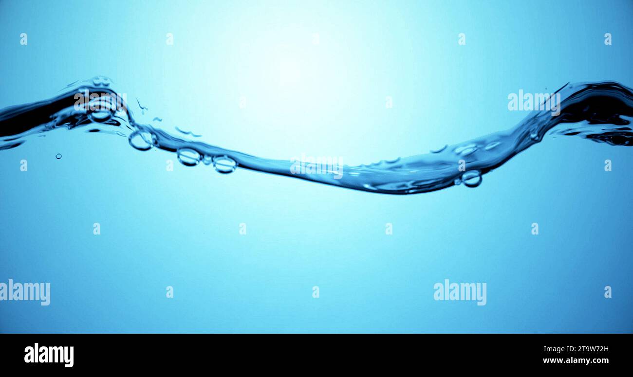 blue wave water with bubbles in tank, slow motion movement Stock Photo