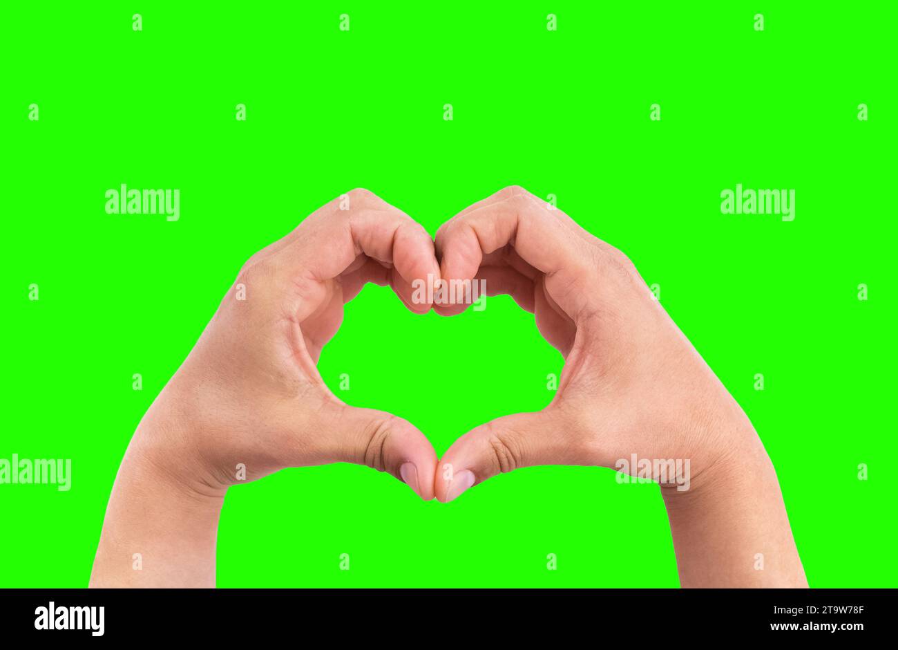man hands in the form of heart against the chroma key green screen background, hands in shape of love heart valentine day concept Stock Photo