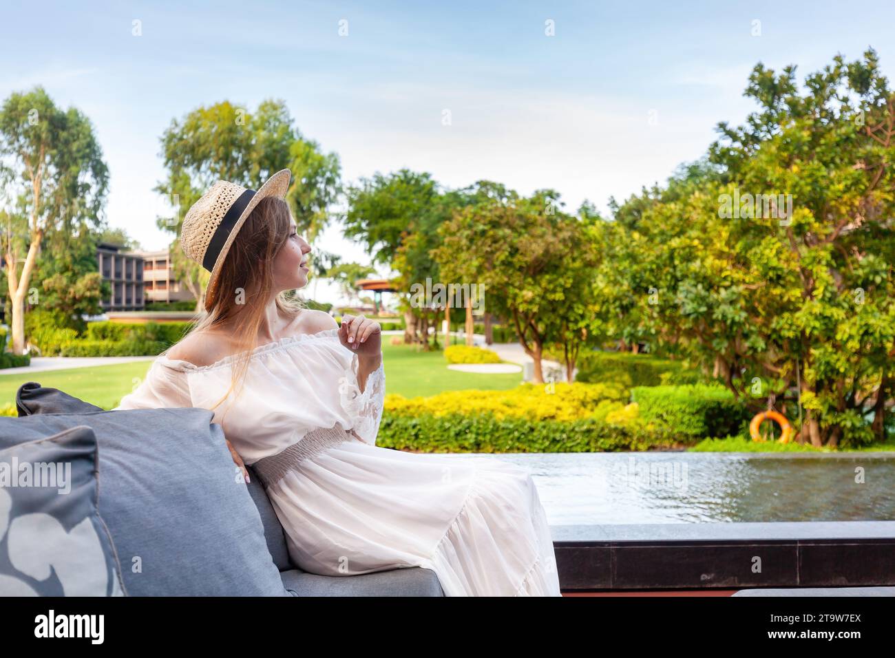 A modern woman enjoys a peaceful moment amidst nature splendor Stock Photo