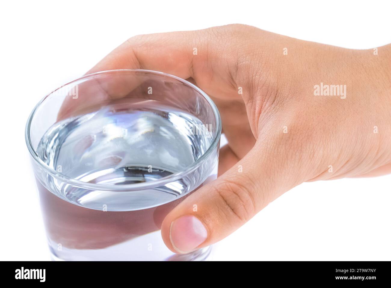 close-up of hand of a man giving a glass with water on white background, help or wellness concept Stock Photo
