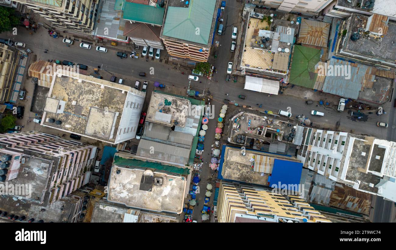 Aerial view of a bustling city street filled with cars and tall ...