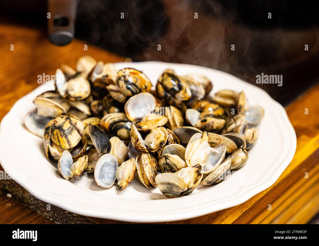 Close-up of a seafood dish, clams cooked healthy on the grill Stock Photo