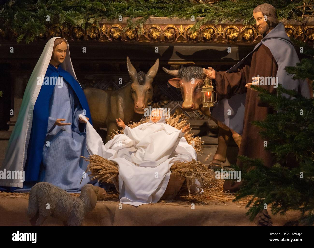 Nativity scene in church. Mary, Jesus, Joseph and animals. Christmas decoration. Closeup. Holiday celebration. Metz, France. Stock Photo