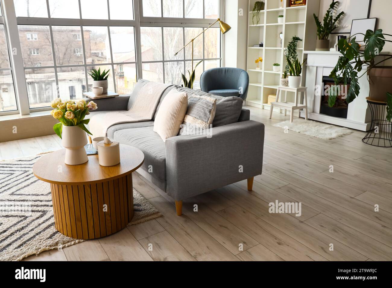 Interior of bright living room with grey sofa and coffee table Stock ...