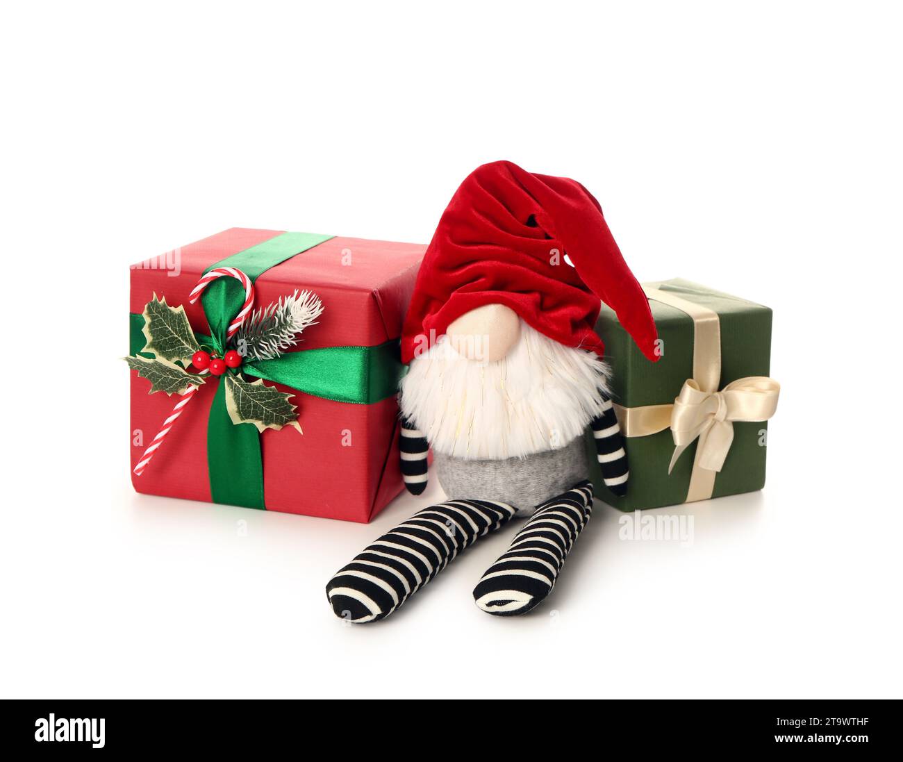 Christmas gnome with gift boxes isolated on white background Stock