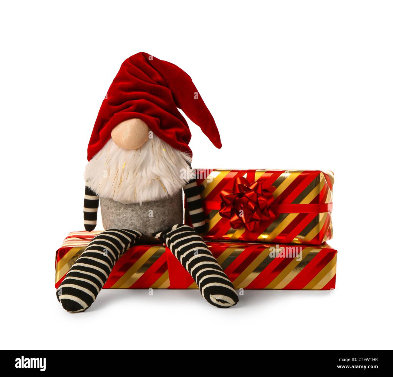 Christmas gnome with gift boxes isolated on white background Stock