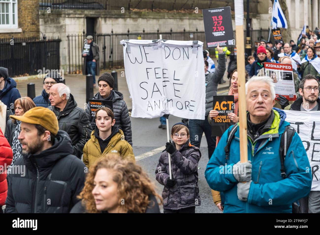 Child with a placard We don't Feel Safe Anymore, March against antisemitism, tens of thousands people protest against a rise in hate crimes against Je Stock Photo