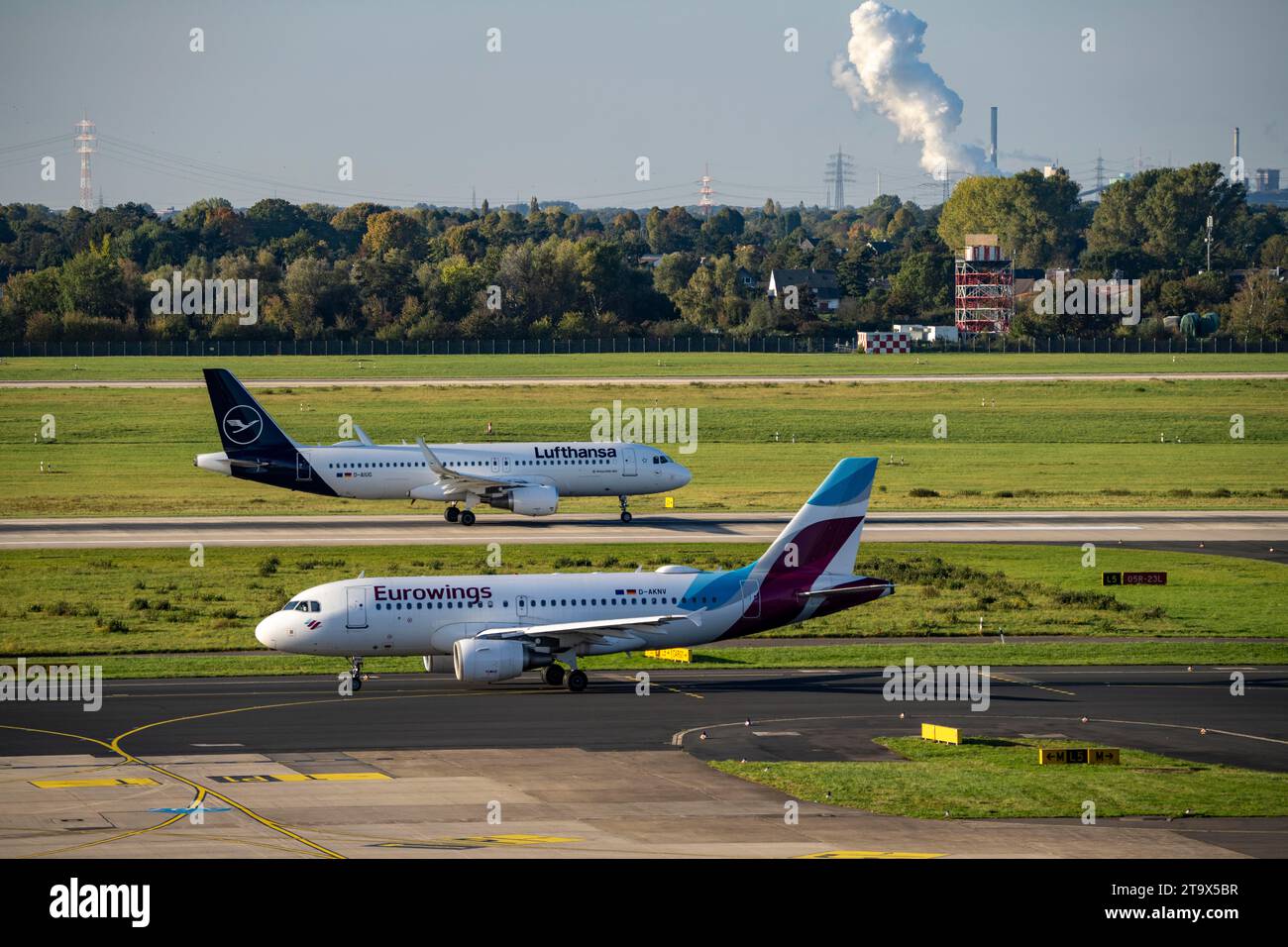 Düsseldorf Airport, Lufthansa Airbus A320-200 and Eurowings Airbus A319-100 on the taxiway, Stock Photo