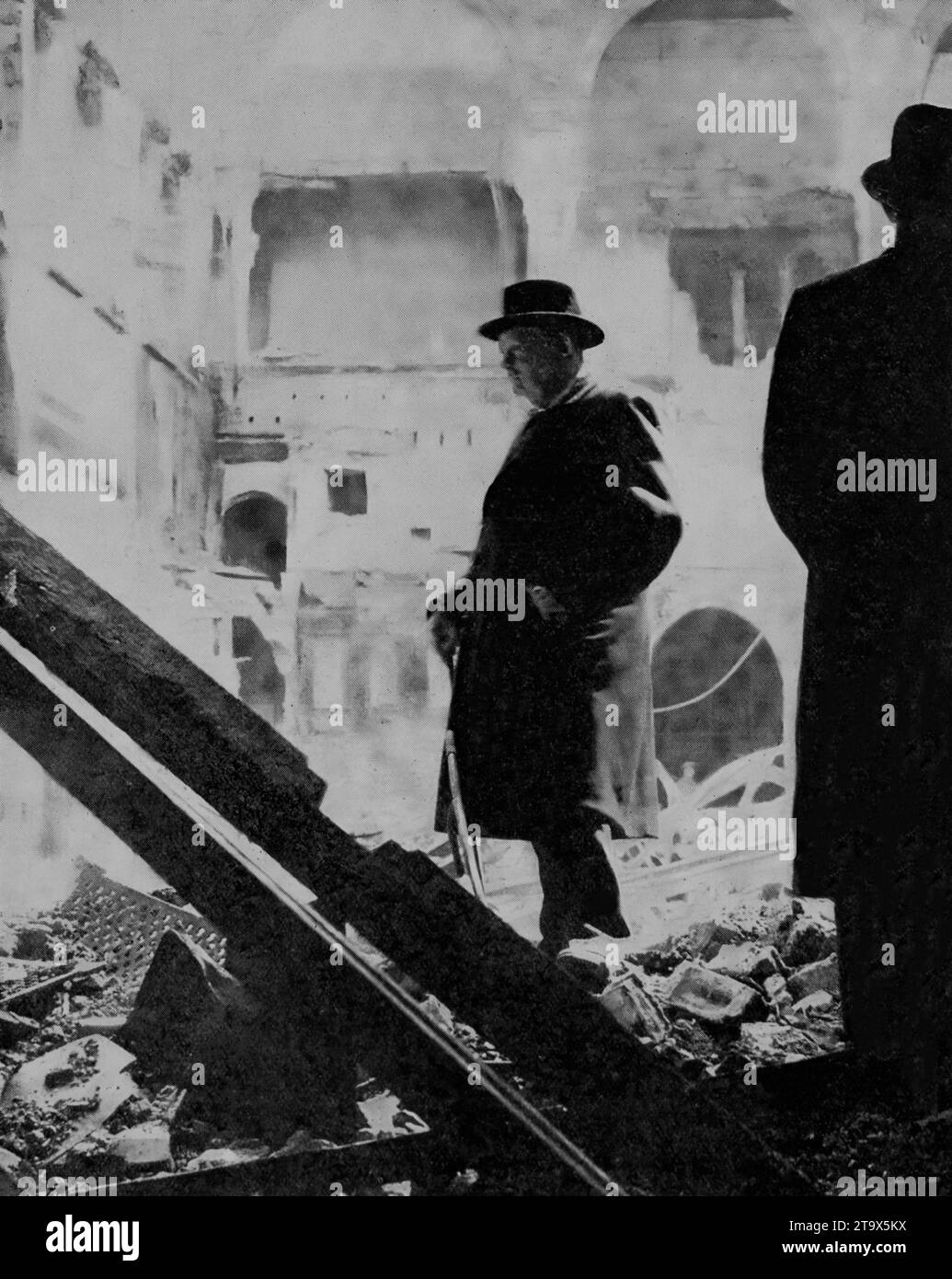 The night of 10th May 1941 was moonlit and clear presenting an opportunity for the Luftwaffe to bomb London during the Second World War. Westminster Abbey, British Museum, offices and homes were hit or burnt out during the air raids. Prime Minister Winston Churchill inspects the ruins of part of the Houses of Parliament also damaged. Stock Photo