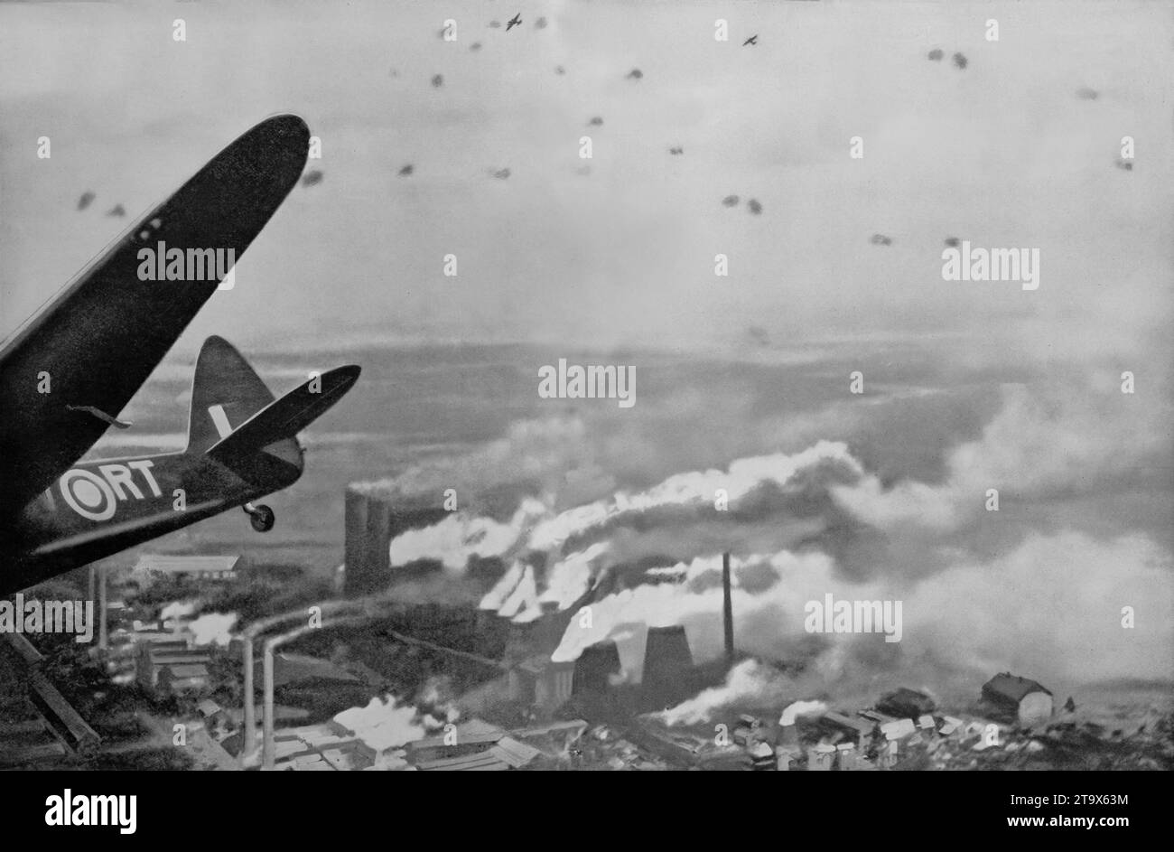 On the 12th August 1941 twelve squadrons of Blenheim bombers attacked industrial districts of Cologne, in Germany during the Second World War. The photograph shows a Blenheim after dropping its bombs on the Knapsack Power Station with two more aircraft above avoiding defensive German anti-aircraft fire. Stock Photo