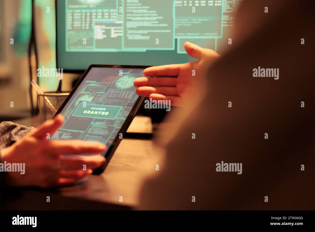 Access granted message on digital tablet, successful database hacking, criminal cracking password. Cyberattack, internet thieves stealing electronic information, using malicious software Stock Photo