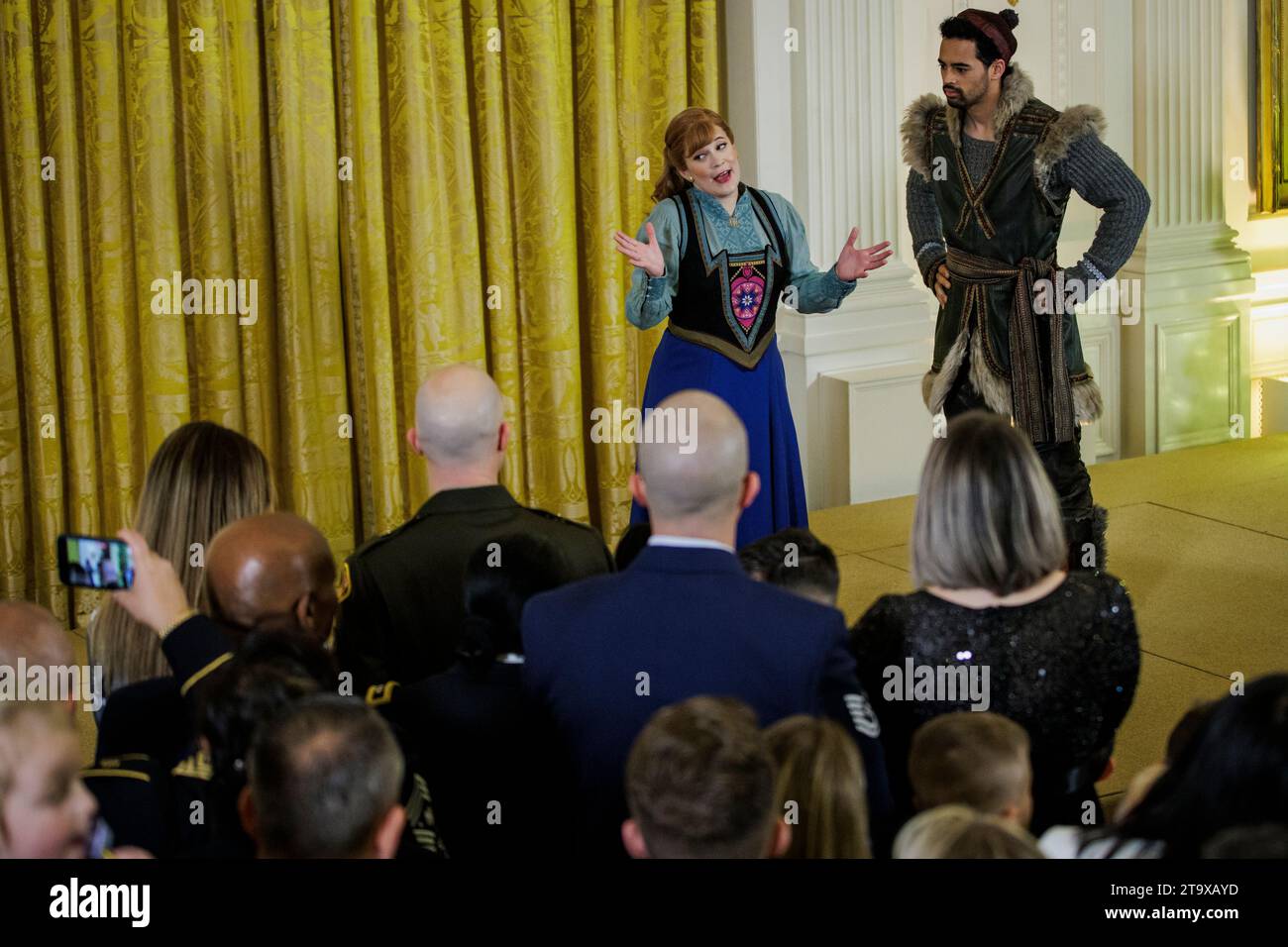 Washington, United States. 27th Nov, 2023. Lauren Nicole Chapman as Anna (L) and Dominic Dorset as Kristoff (R) sing during a holiday event in the East Room of the White House on November 27, 2023 in Washington, DC First Lady Jill Biden is hosting cast members from Disney's stage musical Frozen for the children of military families during the holidays. (Photo by Samuel Corum/Sipa USA) Credit: Sipa USA/Alamy Live News Stock Photo