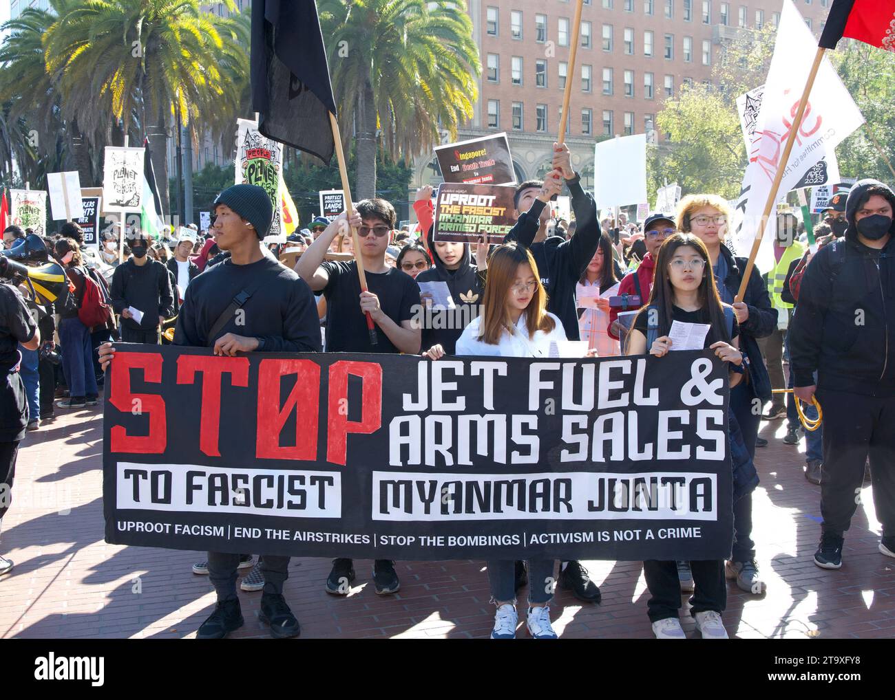 San Francisco, CA - Nov 12, 2023: Participants protesting APEC meeting in the city, joined by pro-Palestine protesters protesting the war. Marching up Stock Photo
