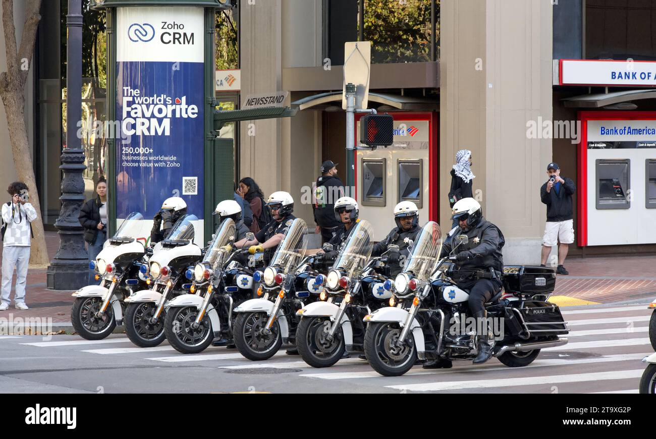 San Francisco, CA - Nov 12, 2023: Police officers stand by for traffic and crowd control for APEC Protest down Market Street. Stock Photo