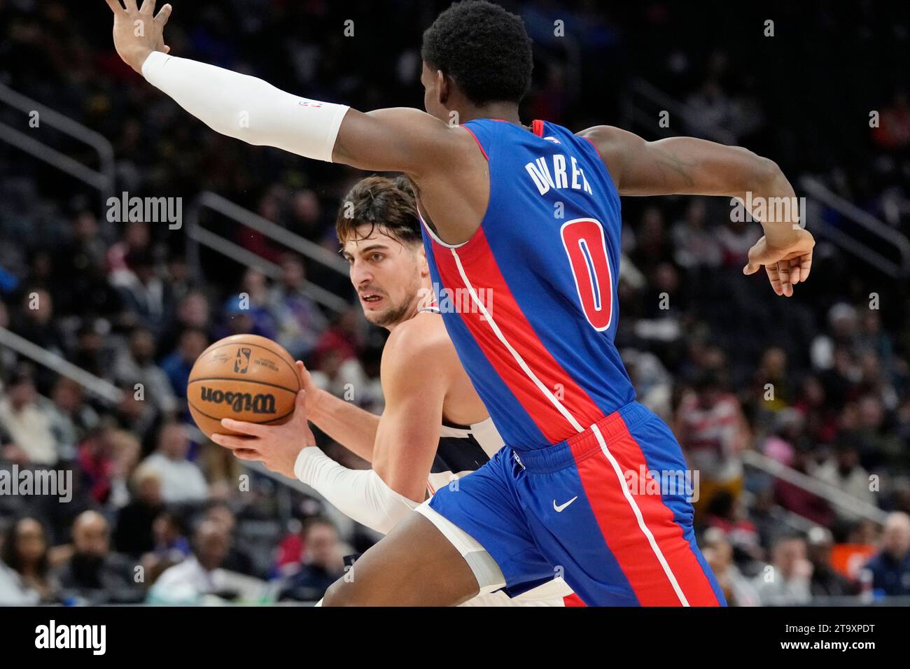 Washington Wizards forward Deni Avdija is defended by Detroit Pistons