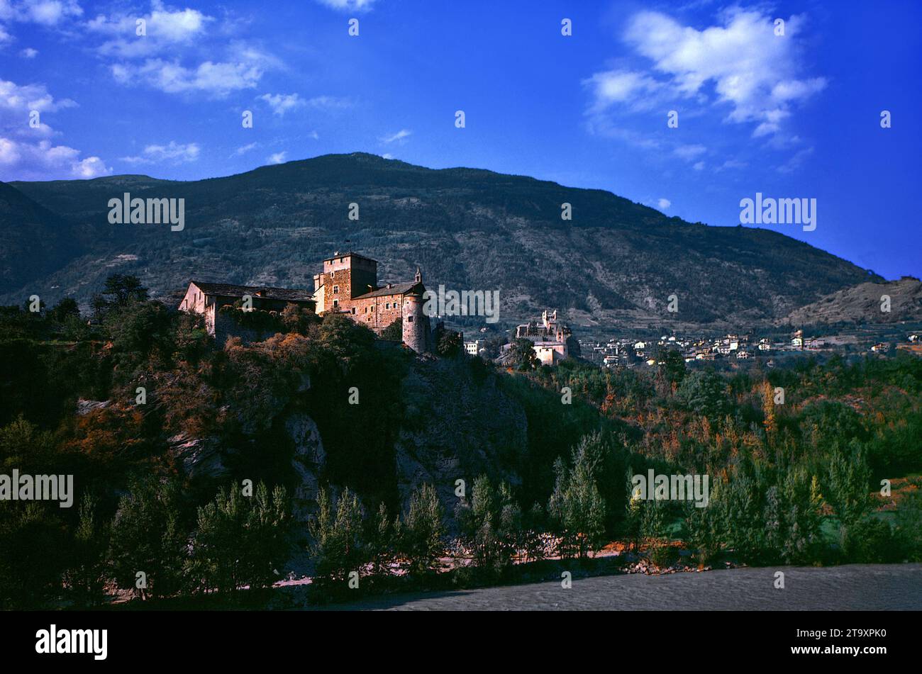 Aosta Valley.Saint Pierre: Sarriod de La Tour castle in the foreground overlooking the Dora Baltea river.(South view). Stock Photo