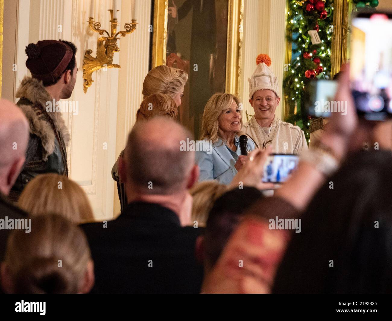 November 27, 2023, Washington, District of Columbia, USA: First Lady JILL BIDEN joins Frozen cast members on stage following a special performance of songs from the Disney musical presented for National Guard and local military families at the White House. DOMINIC DORSET (Kristoff), CAROLINE BOWMAN (Elsa) and JEREMY DAVIS (Olaf) stand along side her. (Credit Image: © Sue Dorfman/ZUMA Press Wire) EDITORIAL USAGE ONLY! Not for Commercial USAGE! Stock Photo