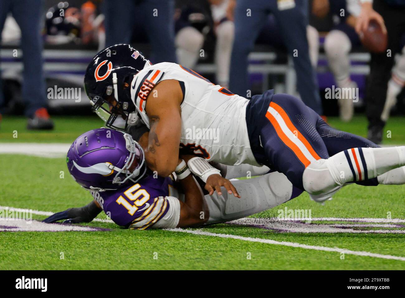 Minnesota Vikings quarterback Joshua Dobbs (15) is sacked by Chicago ...