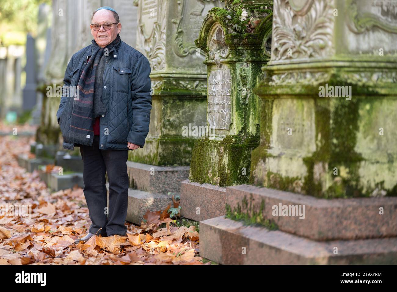 PRODUCTION - 21 November 2023, Hesse, Frankfurt/Main: Majer Szanckower stands in front of the Rothschild family grave at the Old Jewish Cemetery in Frankfurt. He acts as cemetery administrator for the Jewish community in Frankfurt and is the contact person for current mourning cases. Photo: Boris Roessler/dpa Stock Photo