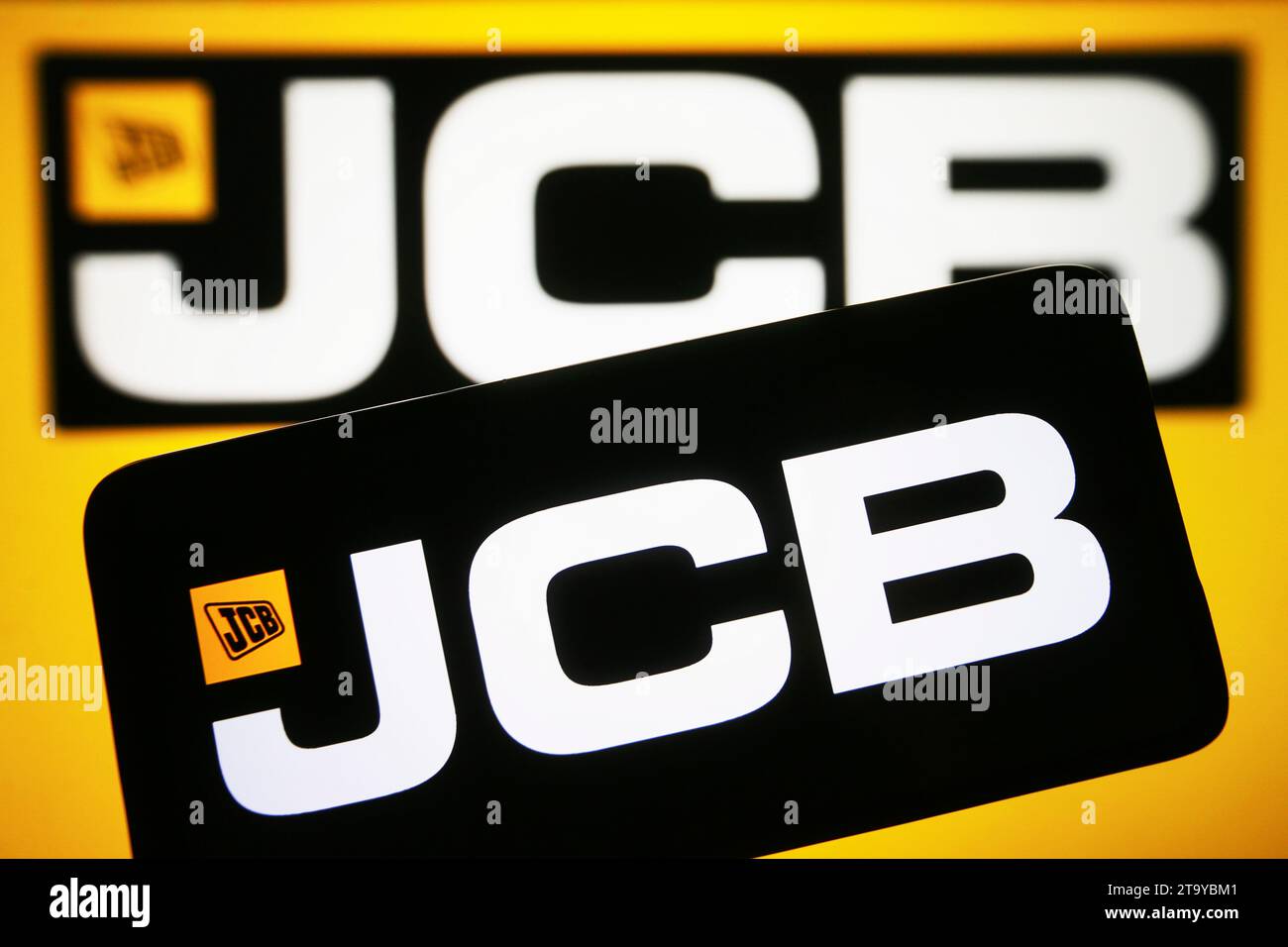 Ukraine. 27th Nov, 2023. In this photo illustration, J.C. Bamford Excavators Limited (JCB) logo is seen on a smartphone and on a pc screen. (Photo by Pavlo Gonchar/SOPA Images/Sipa USA) *** Strictly for editorial news purposes only *** Credit: Sipa USA/Alamy Live News Stock Photo