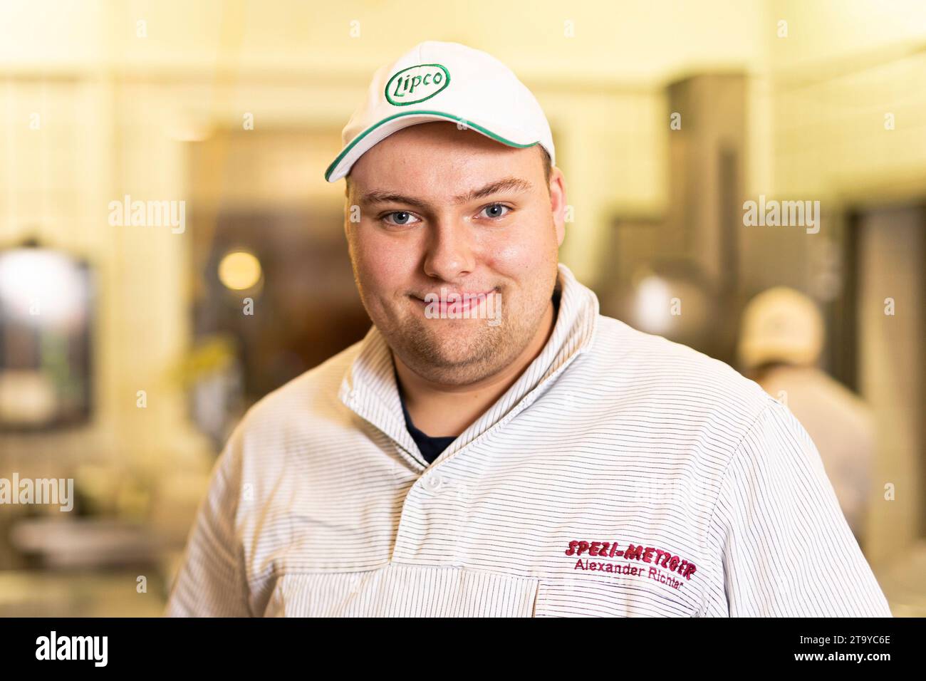 Wolsdorf, Germany. 22nd Nov, 2023. Alexander Richter, butcher, poses for a photo in the premises