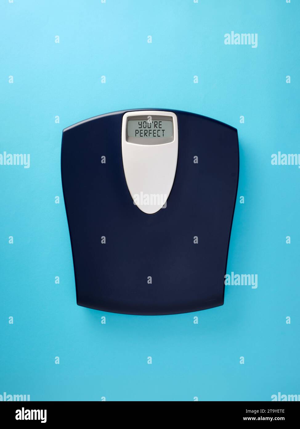 Digital bathroom scale with the message you're perfect on blue