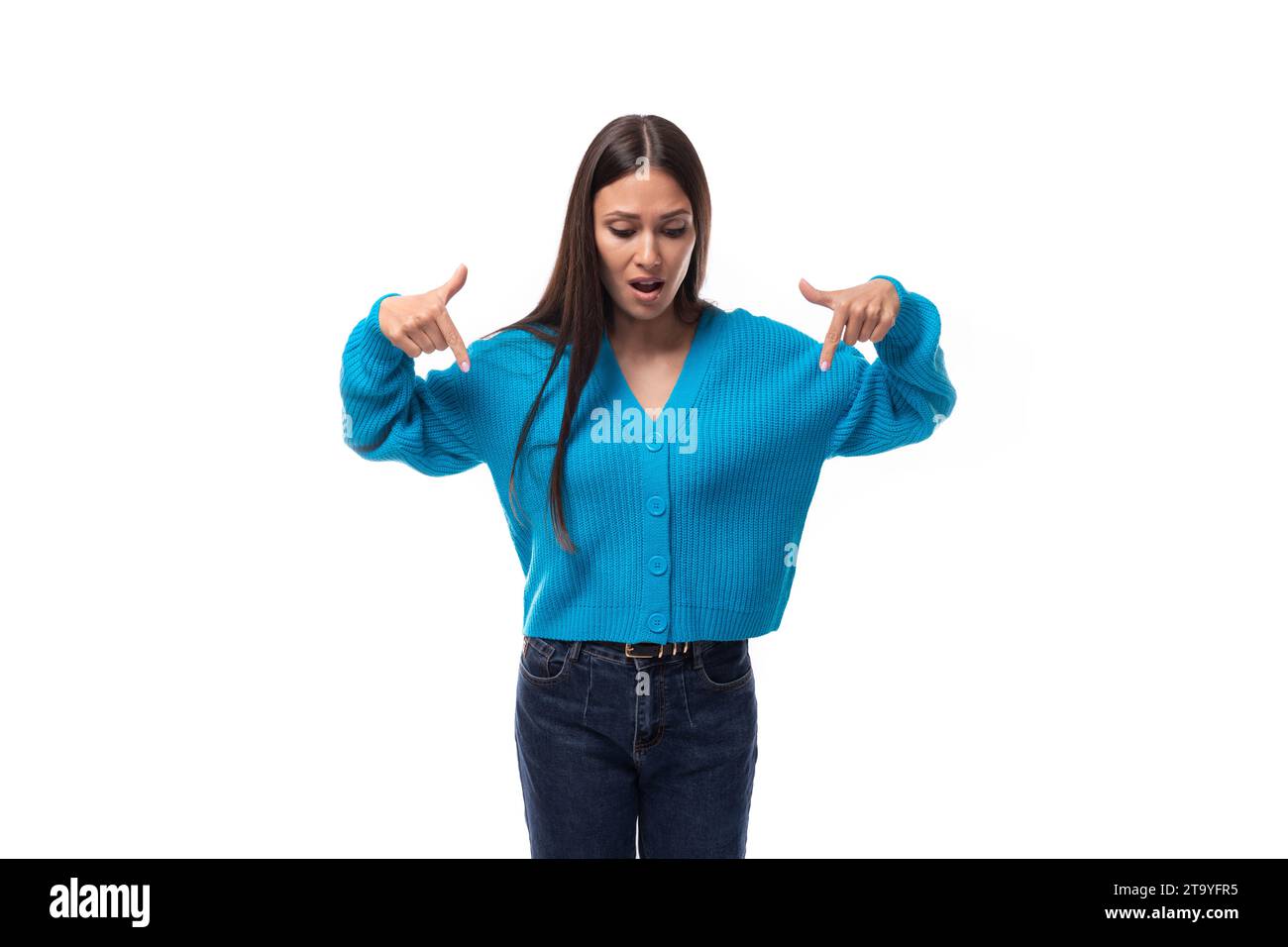 inspired successful cute young woman dressed in blue cardigan Stock Photo