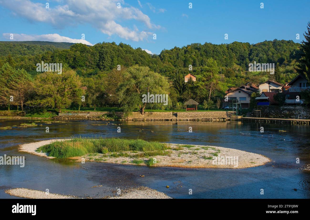 The River Una as it passes through Kulen Vakuf village in the Una National Park. Una-Sana Canton, Federation of Bosnia and Herzegovina.Early September Stock Photo