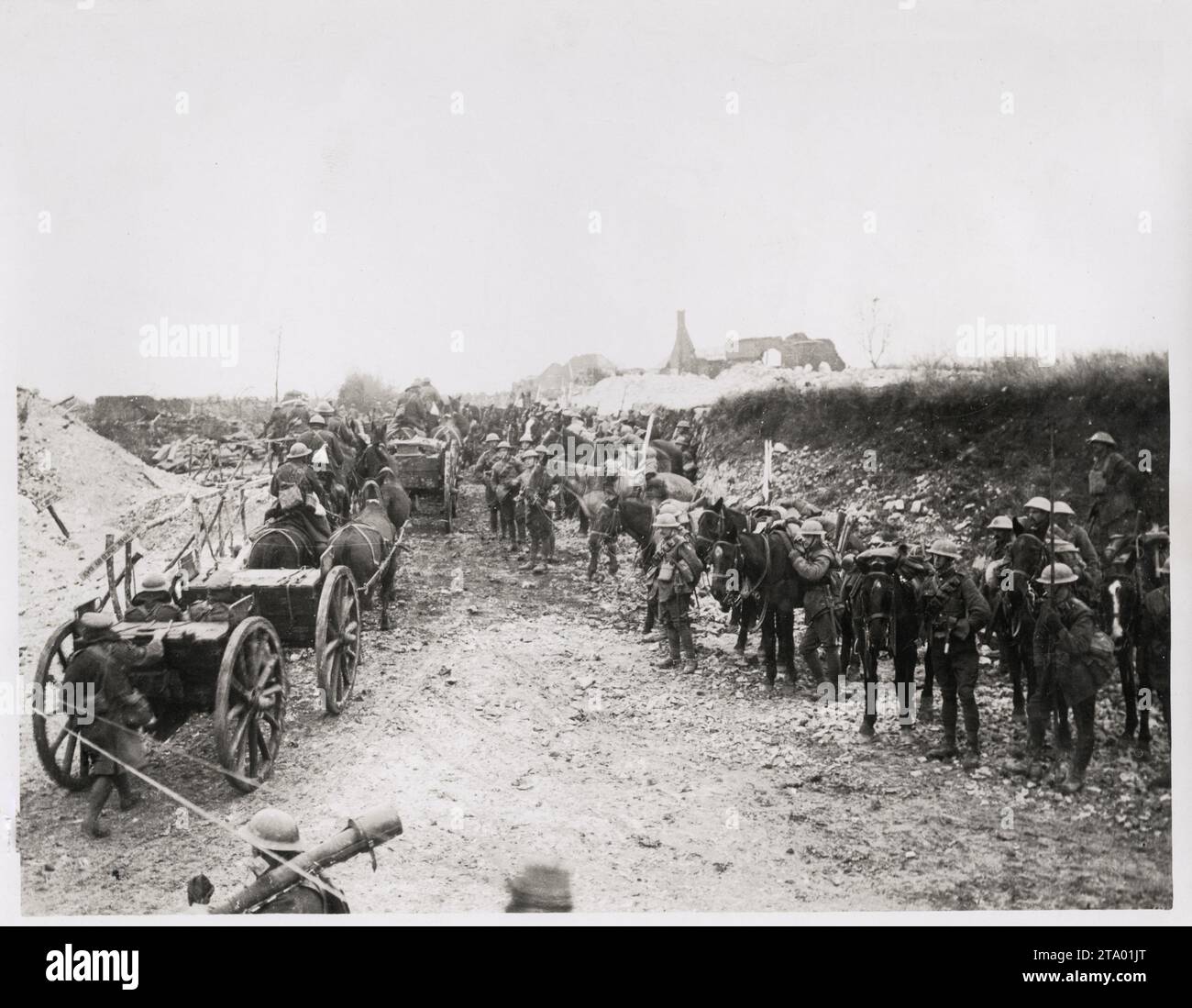 WW1 World War I - Cavalry make way for guns in a captured village Stock Photo