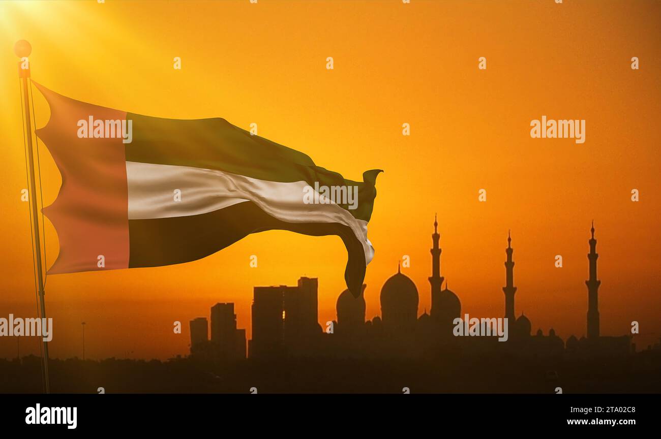 waving fabric texture of the flag with color of united arab emirates at sunset with sun rays light, uae on mosque silhouette in background Stock Photo