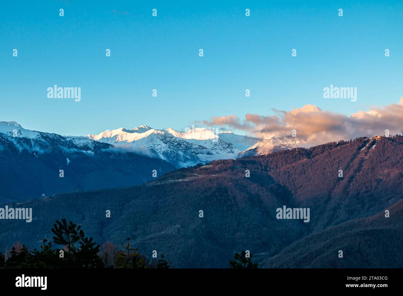 High mountain peaks covered with snow on a clear day Stock Photo - Alamy