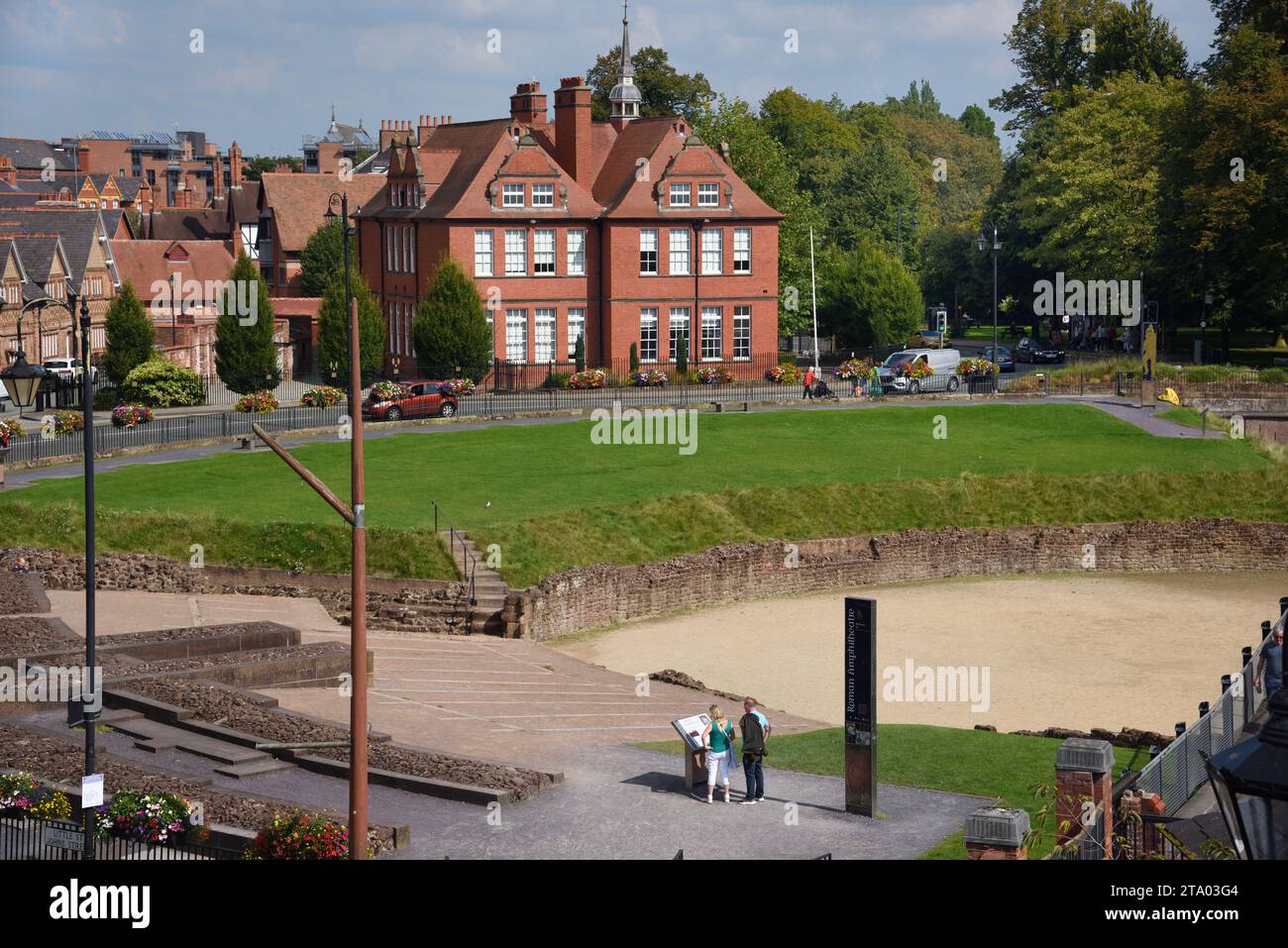 Tourists Reading Information Panels at the Site of Chester Roman Amphitheatre Chester Stock Photo