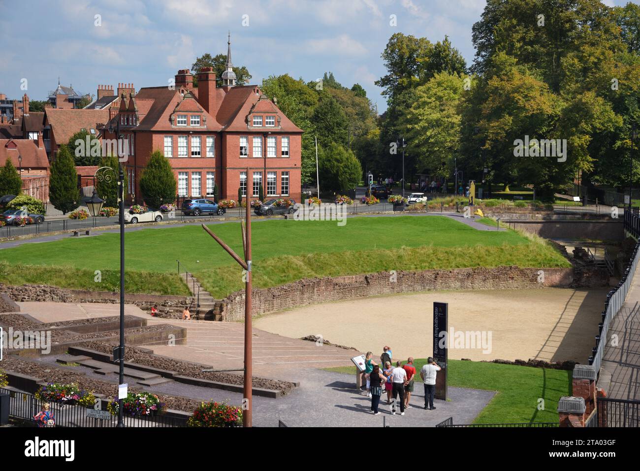 Tourists Reading Information Panels at the Site of Chester Roman Amphitheatre Chester Stock Photo