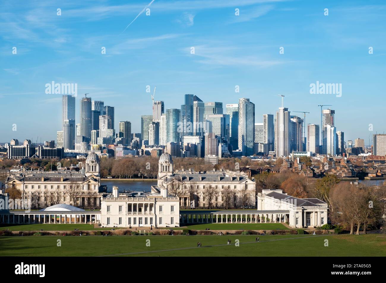 A view from Greenwich Park, London looking across the Old Royal Naval College towards the skyscrapers in the Canary Wharf business district Stock Photo