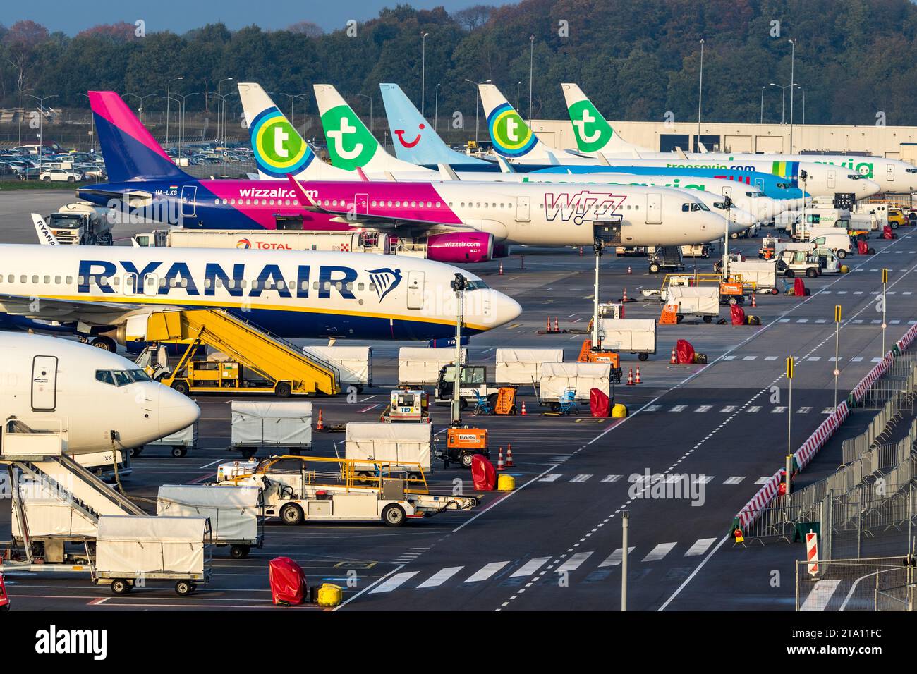 Various low-budget airline aircraft parked at the terminal of Eindhoven-Airport. Eindhoven, The Netherlands - October 25, 2017 Stock Photo