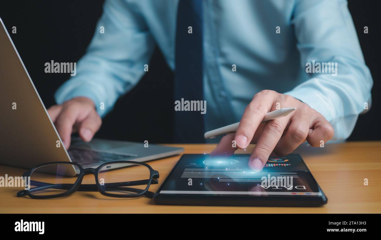 Business people use computers to analyze business and manage corporate ...
