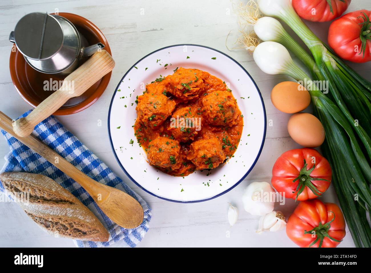 Meat meatballs with tomato sauce and vegetables. Traditional Spanish tapa recipe. Stock Photo
