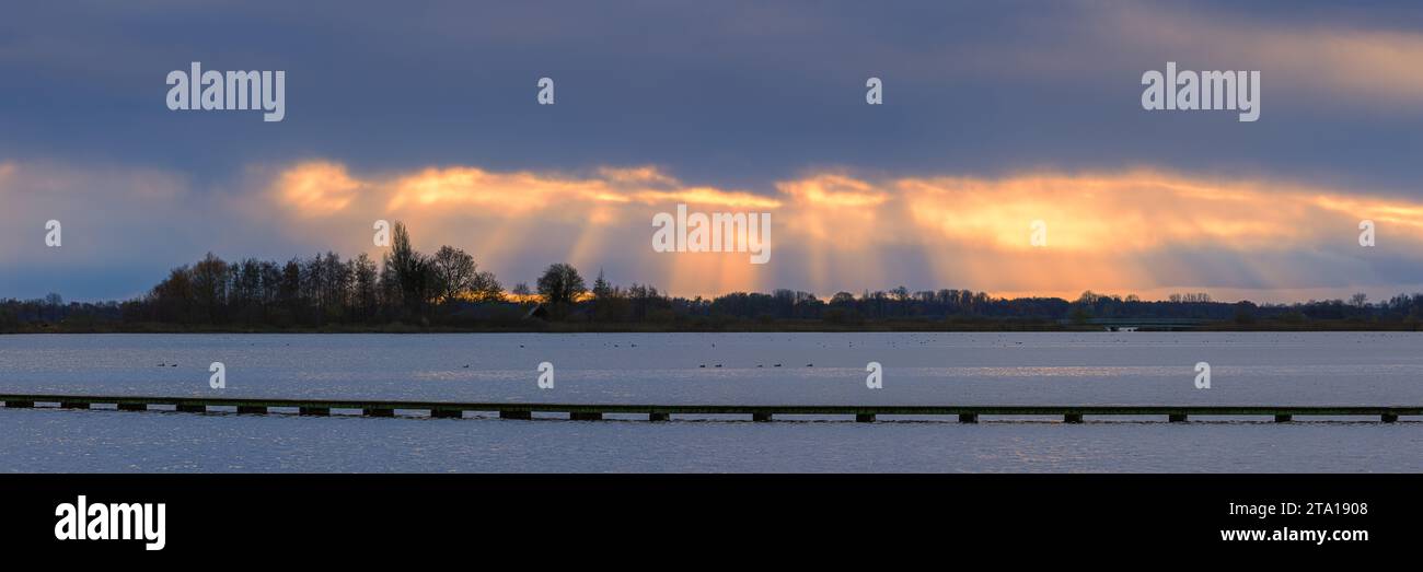 A wide 3:1 panoramic image during sunset in the nature reserve, 't Roegwold, located on the Dannemeer near the village of Schildwolde in the province Stock Photo