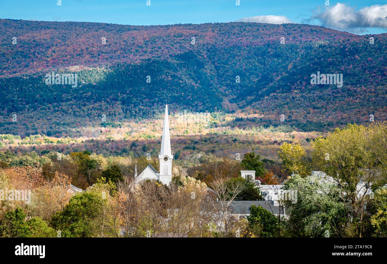 View of Manchester Village with church steeple during the fall with colorful Taconic Mountains in the background. Stock Photo