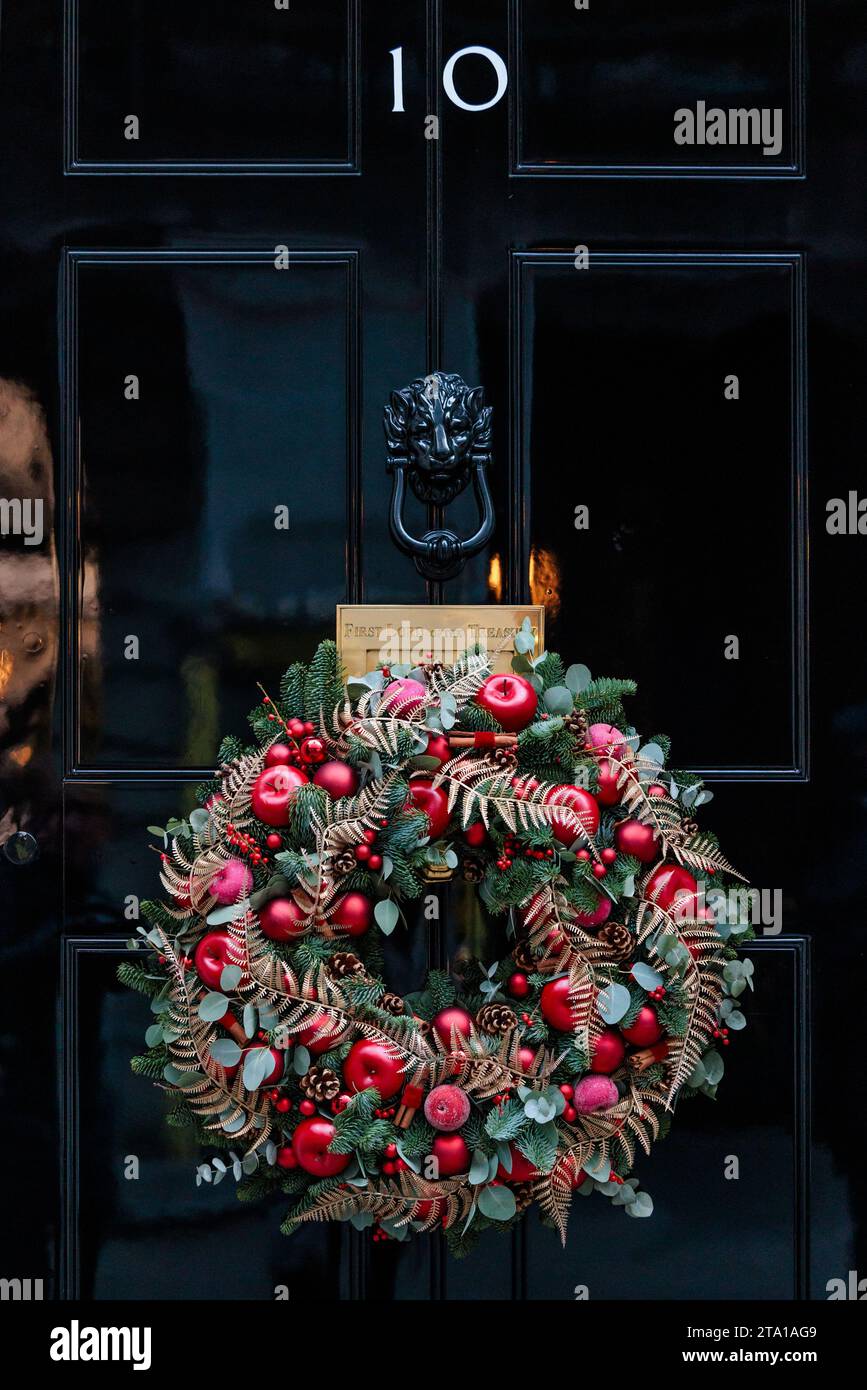 Downing Street, London, UK. 28th November 2023.  Festive wreath adorns the famous black door of No 10 Downing Street. Photo by Amanda Rose/Alamy Live News Stock Photo