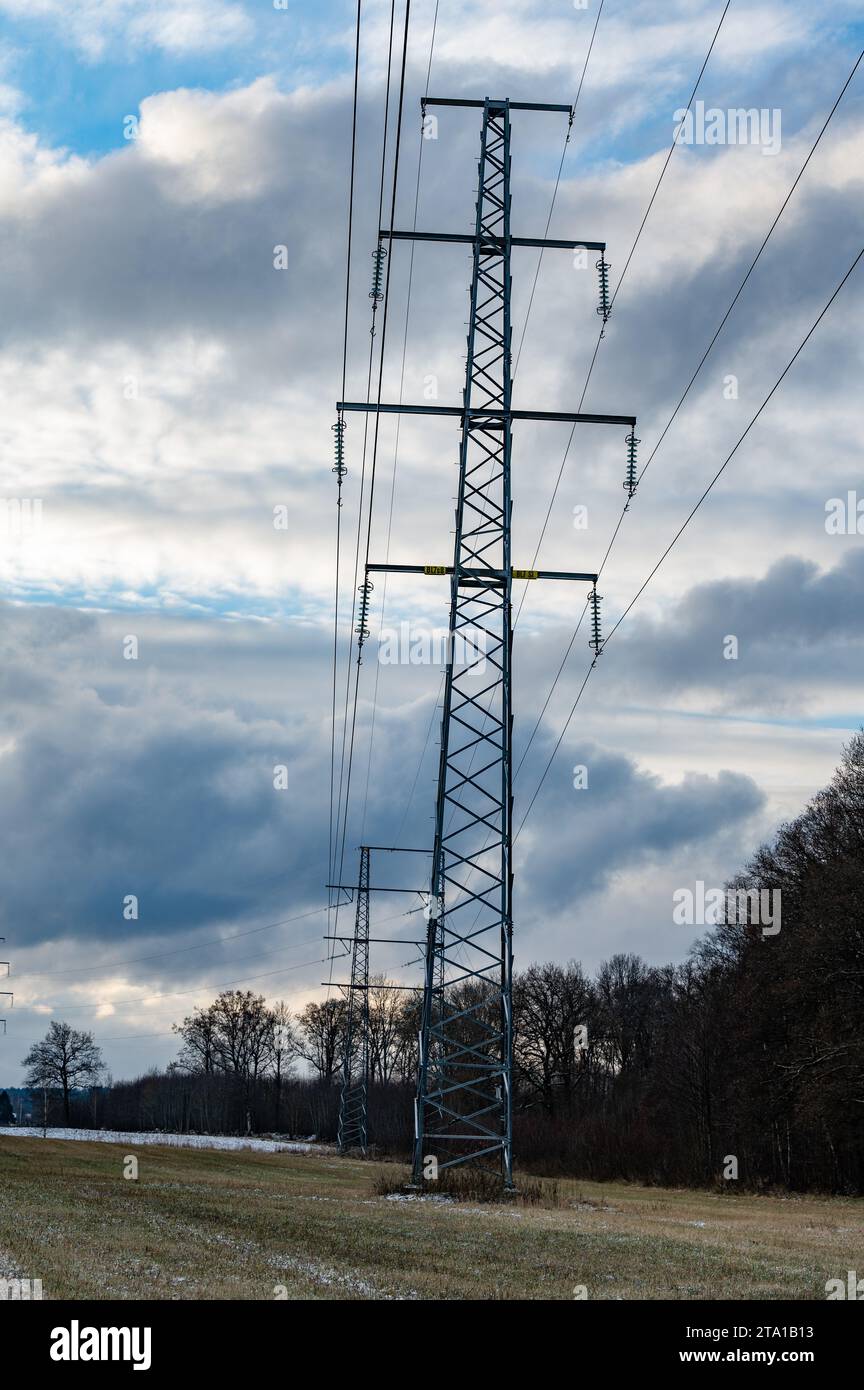 power lines on field infront of cloudy sky Stock Photo - Alamy